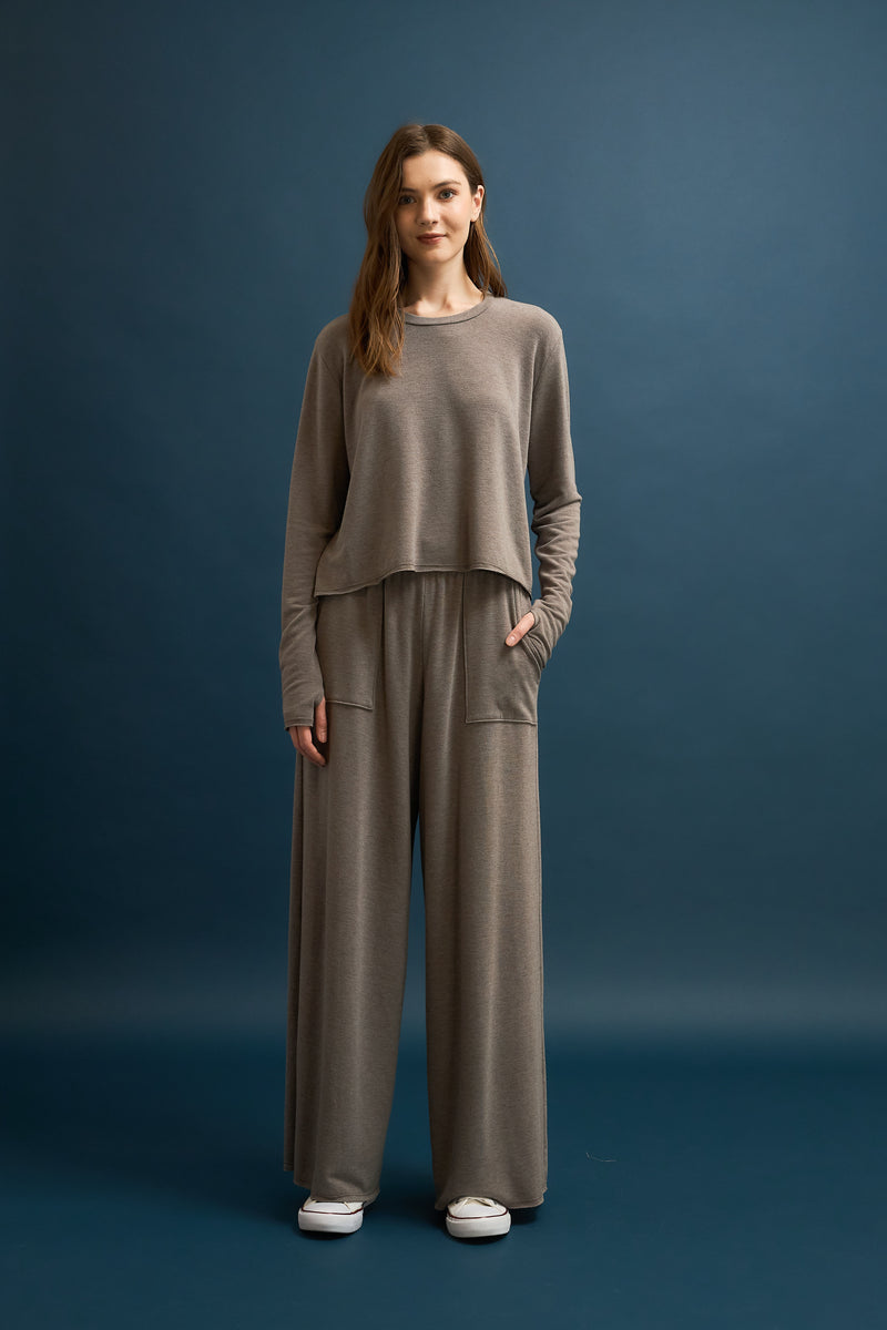 Boxy crop sweatshirt in soft gray French terry fabric, designed for a relaxed fit, perfect for casual Long Island boutique fashion styling.