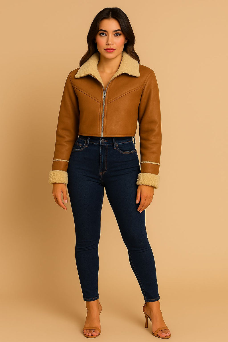 Brown shearling crop jacket with a cozy collar and cuffs, paired with high-waisted jeans, showcasing trendy Long Island boutique fashion.