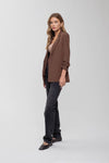 Chic brown 3/4 ruched sleeve blazer paired with black jeans, perfect for stylish ensembles from a Long Island fashion boutique.