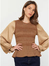 Model wearing gold glitter flared sweater with peplum hem and satin sleeves – TandyWear Boutique