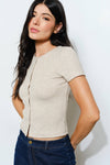 Ribbed beige button-up tee with a fitted silhouette and short sleeves, perfect for effortless Long Island boutique fashion.