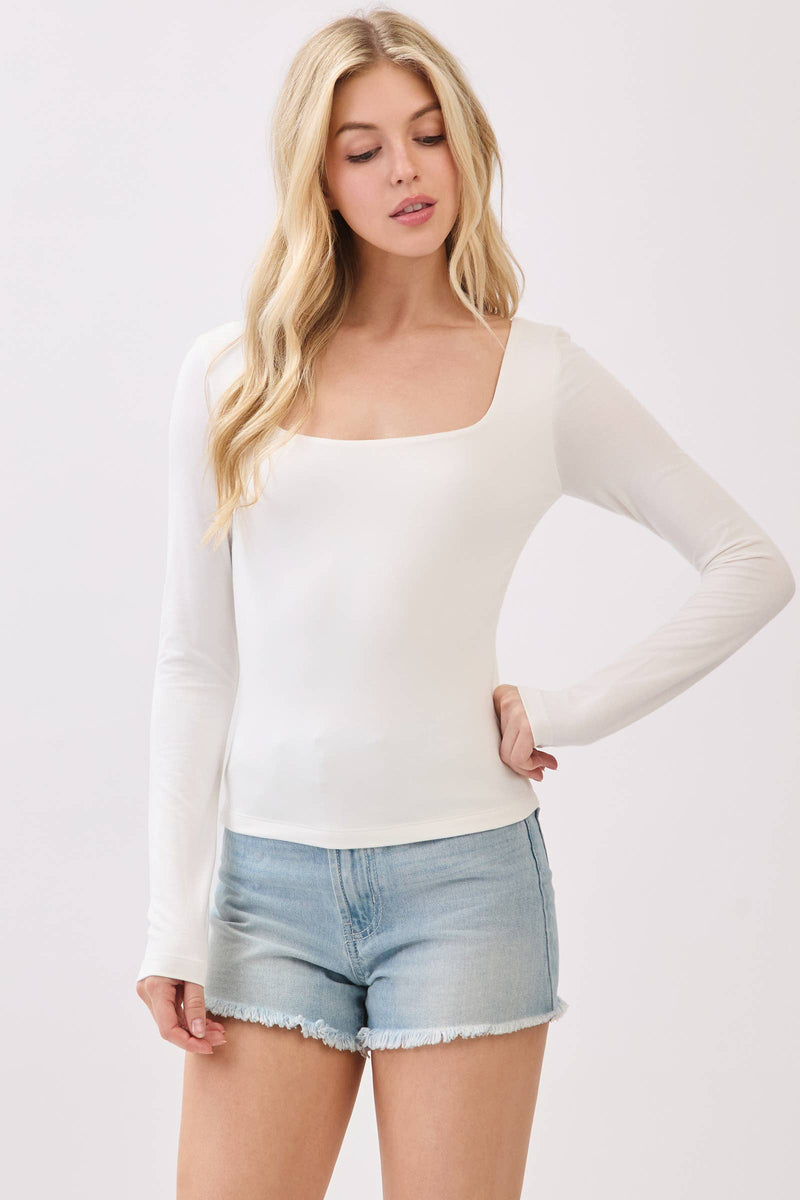 This double-layer square neck long sleeve top in soft white offers a fitted silhouette, perfect for layering in Long Island boutique fashion.