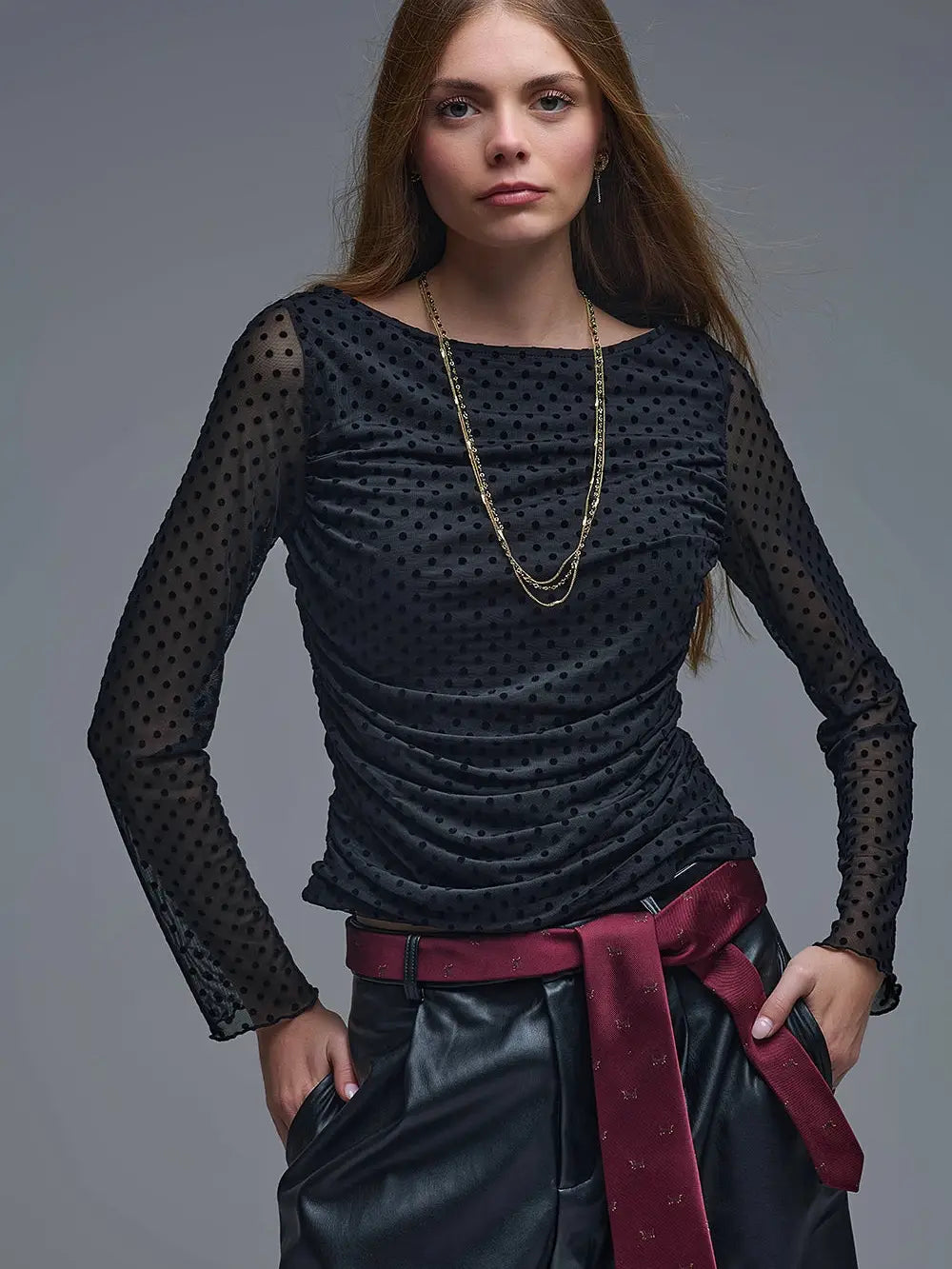 Black sheer polka dot top with long sleeves and textured fabric, perfect for a stylish outfit from a Long Island boutique fashion.