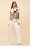 Faux leather moto jacket vest with shearling trim in earthy tones, offering a stylish, cropped fit perfect for Long Island boutique fashion.