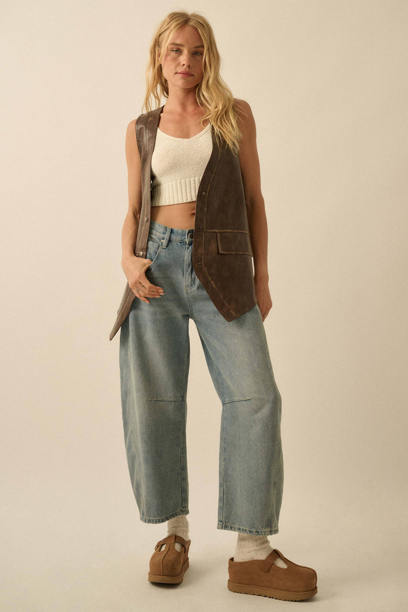A chic faux leather snap-front vest in rich brown, paired effortlessly with high-waisted jeans, showcasing Long Island boutique fashion.