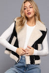 Soft black faux suede vest with plush cream inner fur, featuring a stylish zip-up front and chic collar, ideal for Long Island boutique fashion.