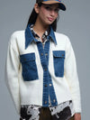 Cream knitted cardigan featuring blue denim details, with a relaxed fit and stylish front pockets, perfect for Long Island boutique fashion.