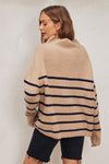 Cozy high neck sweater in a soft beige with navy stripes, featuring a relaxed fit perfect for Long Island boutique fashion.
