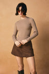 Lightweight, ribbed crew neck sweater in a soft beige hue, perfect for layering in Long Island boutique fashion.