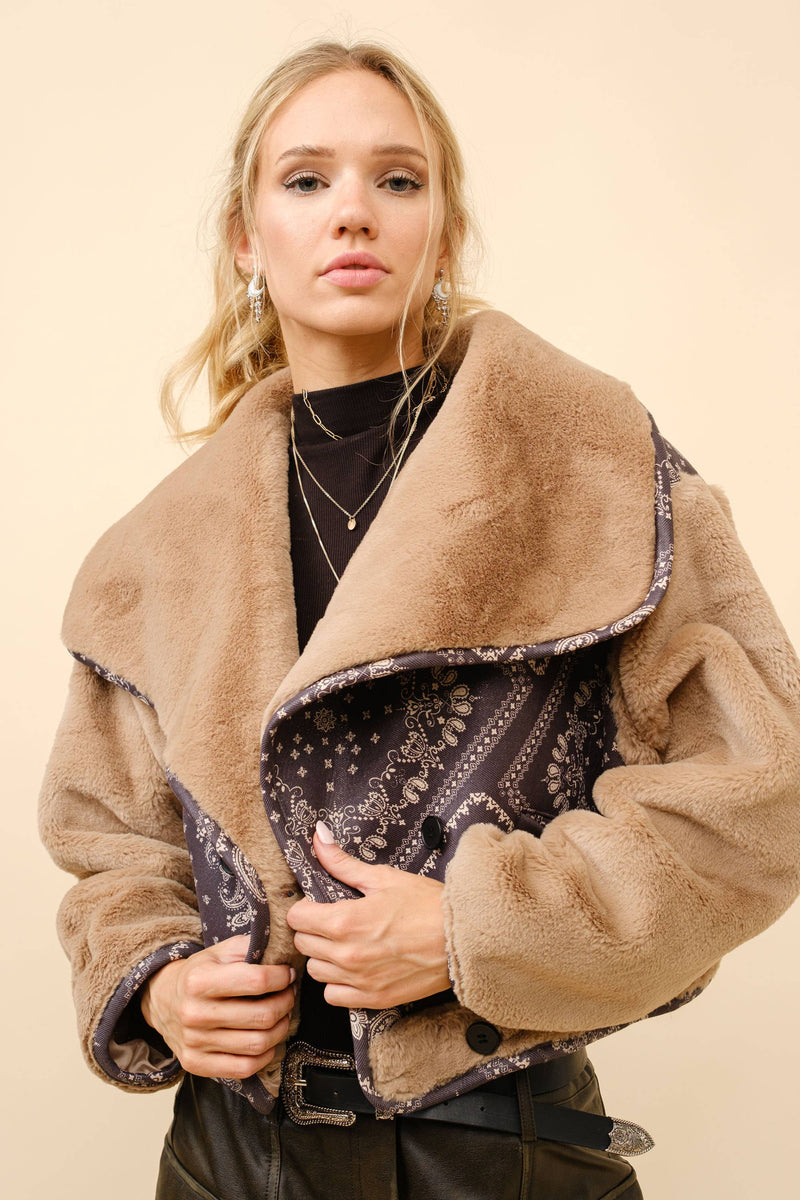 Double-breasted crop jacket featuring a soft fur contrast and a dark paisley bandanna pattern, perfect for Long Island boutique fashion.