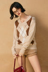 V-neck argyle sweater in beige with brown and white patterns, perfect for cozy layering in Long Island boutique fashion.