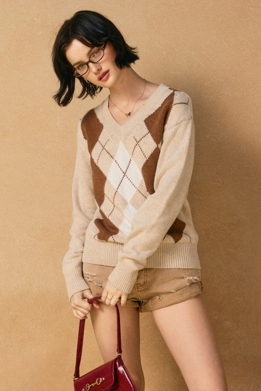 V-neck argyle sweater in beige with brown and white patterns, perfect for cozy layering in Long Island boutique fashion.