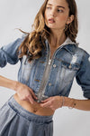 Edgy distressed zip-front jersey hood hybrid denim jacket in light blue, featuring a cropped fit and stylish front pockets, perfect for Long Island boutique fashion.