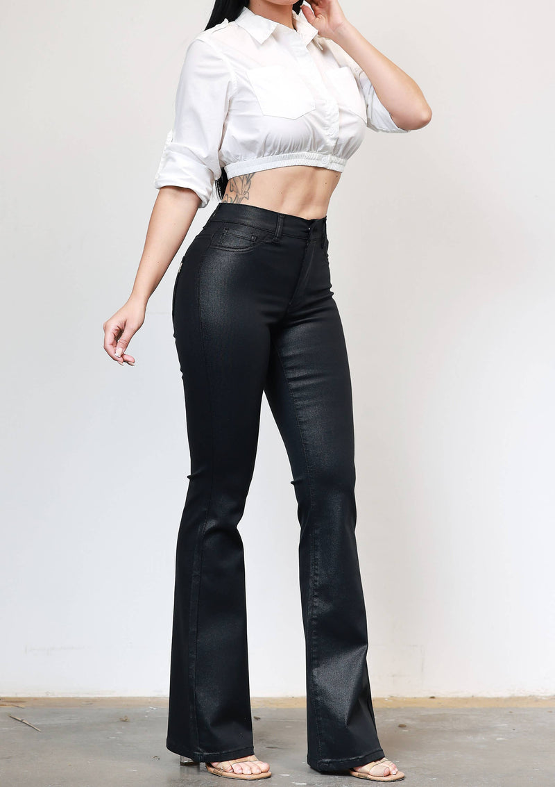 Coated black bootcut jeans feature a slim fit through the hips and flared hem, perfect for a stylish look in Long Island boutique fashion.