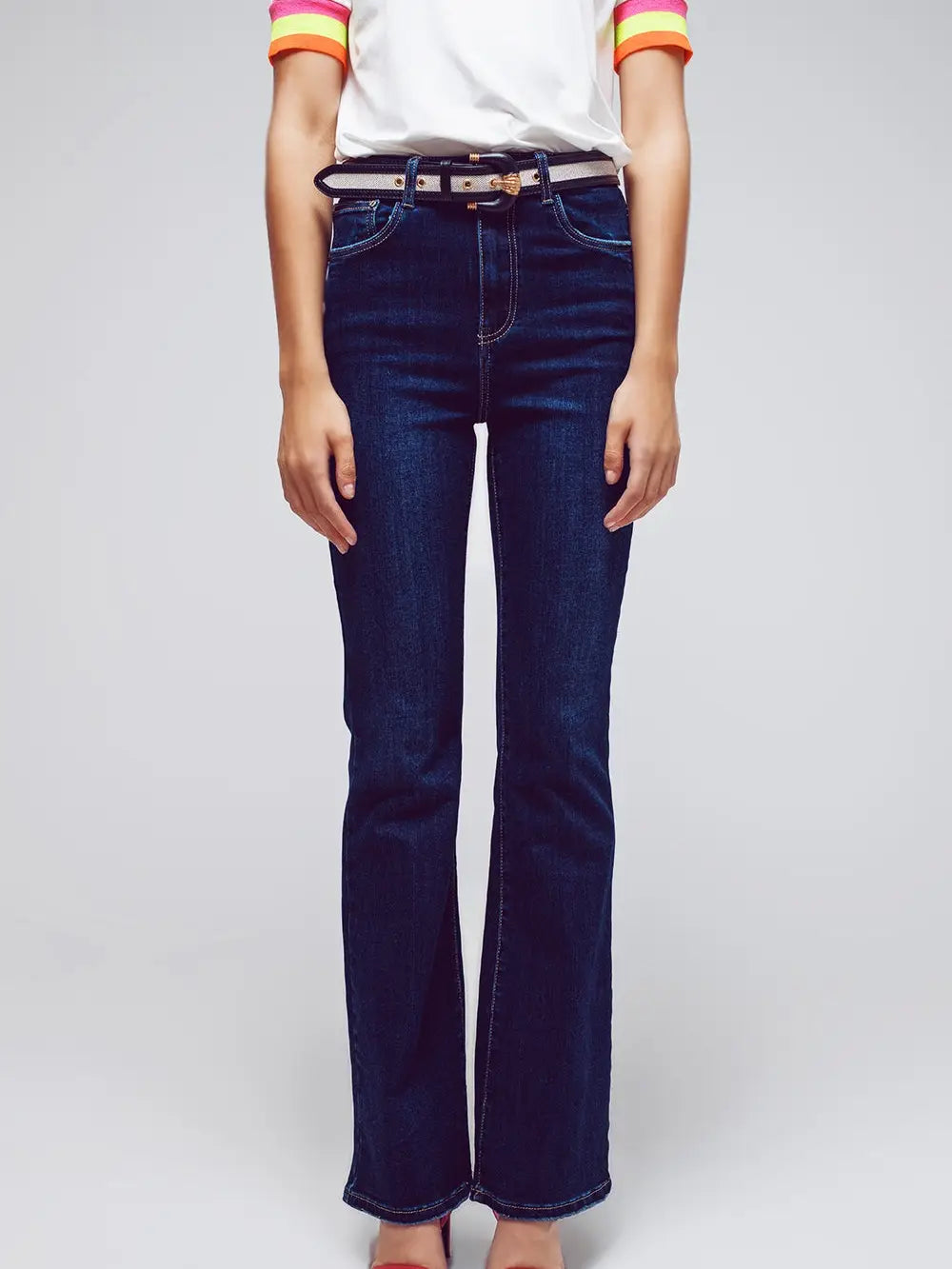 Model wearing dark wash High Waisted Flared Jeans in stretch denim — sleek, flattering fit with a subtle flare, available at TandyWear Boutique in Commack, NY. front view