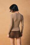 Fitted light brown crew neck sweater in a ribbed texture, perfect for layering in Long Island boutique fashion.
