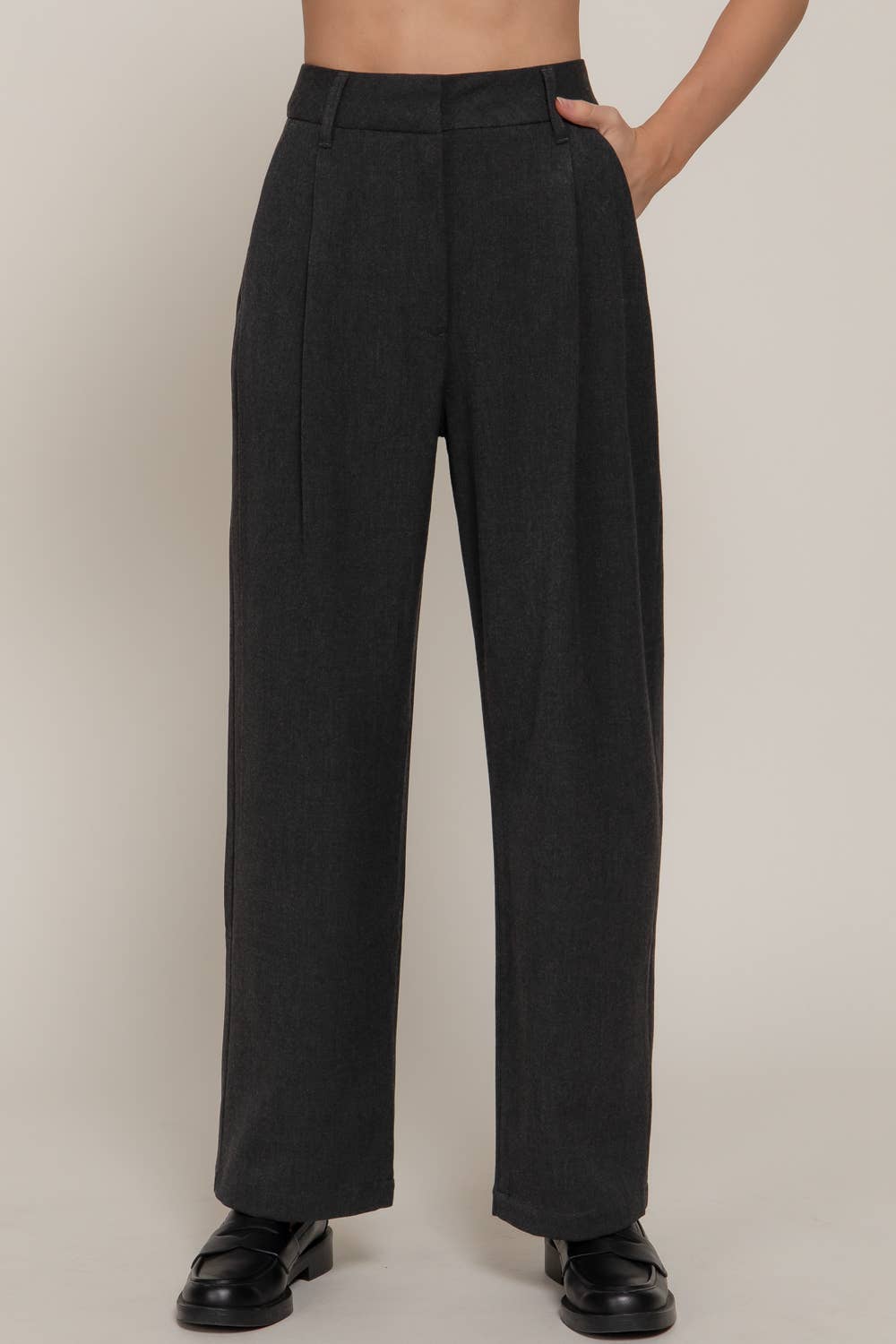 Wide-leg front pleats detail pants in dark charcoal, offering a chic, tailored look perfect for Long Island boutique fashion.