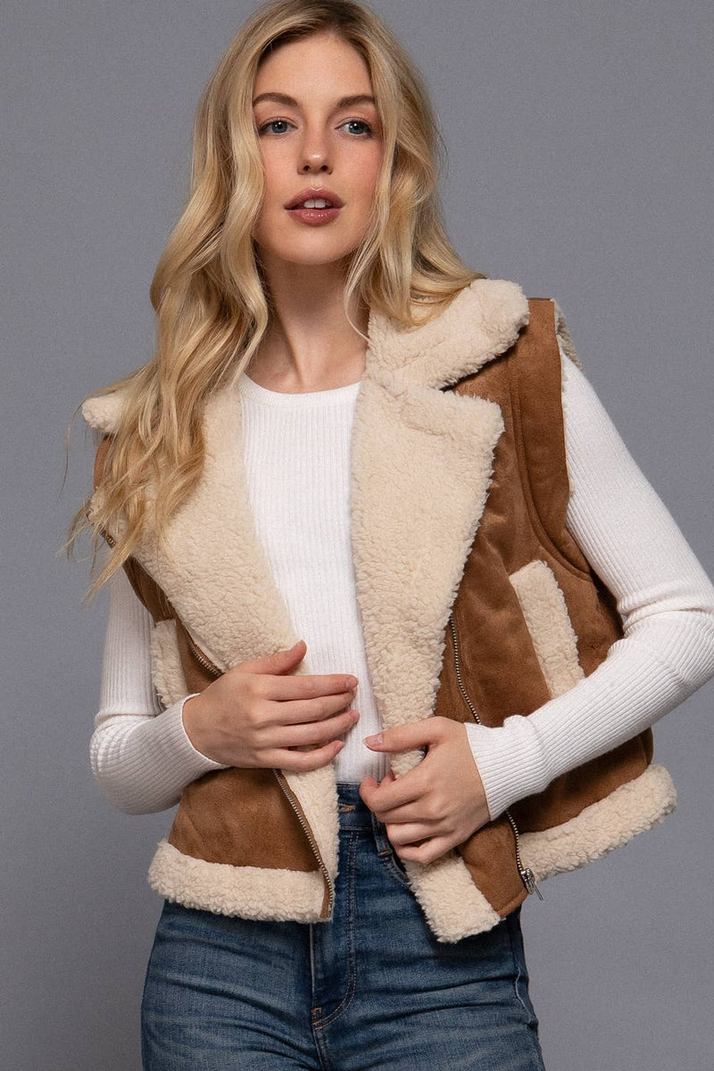 Warm faux suede vest in rich tan with soft inner fur lining, featuring a zip-up front, perfect for stylish layering in Long Island boutique fashion.
