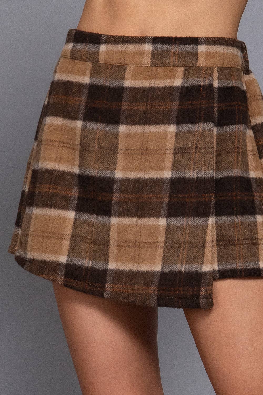 Front wrap plaid short pants in warm browns and soft textures, ideal for a stylish Long Island boutique fashion look.