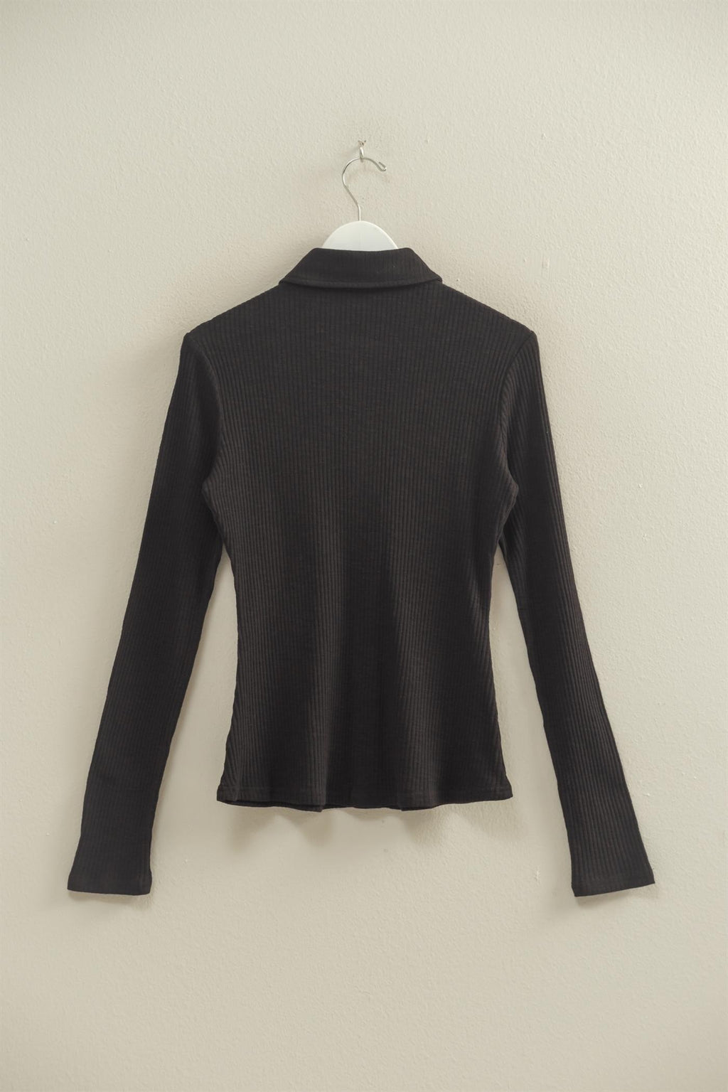 Chic textured black long sleeve button-down shirt featuring a classic collar and ribbed fabric, ideal for Long Island boutique fashion.