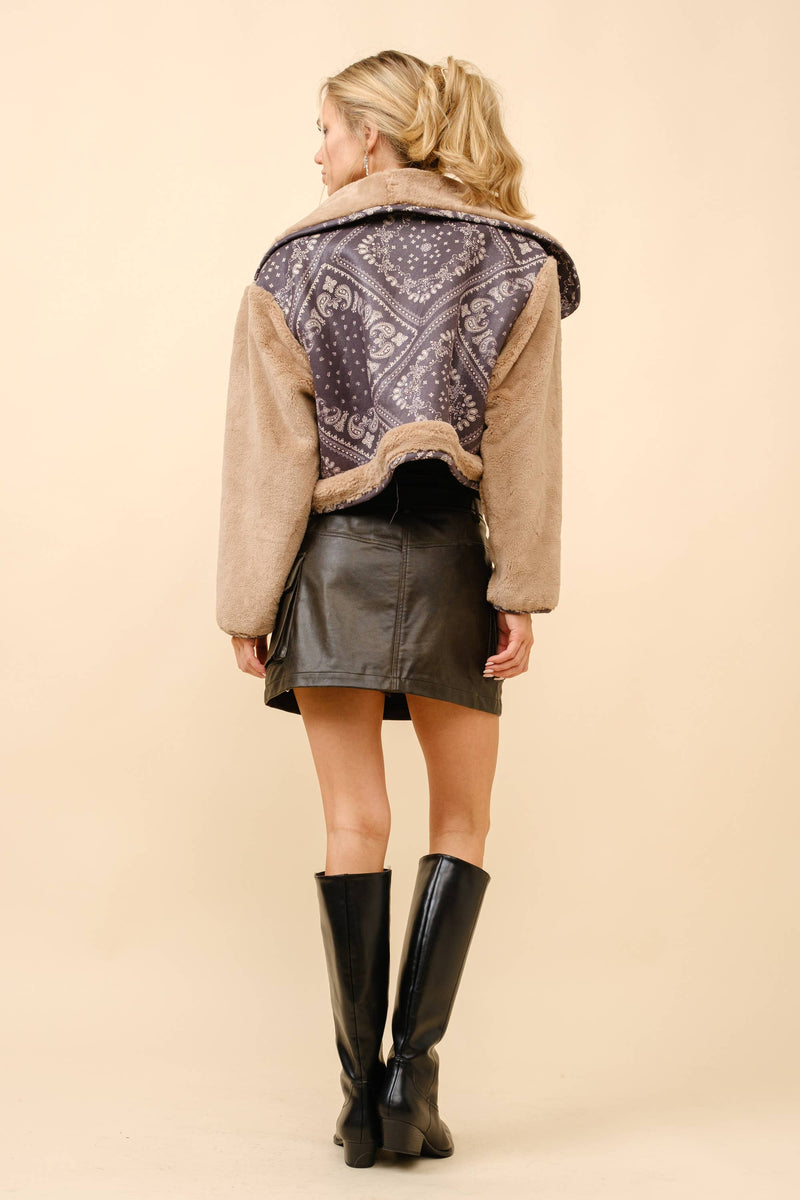 Double breasted crop jacket featuring soft fur sleeves and a contrasting bandanna-patterned back, perfect for Long Island boutique fashion.