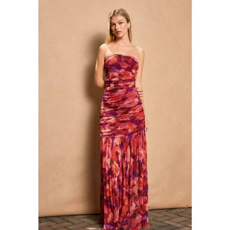 Ruched tube top dress in vibrant shades of purple and red features a fitted bodice and flowing maxi skirt, ideal for Long Island boutique fashion.