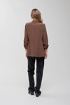 Stylish brown 3/4 ruched sleeve blazer, tailored fit, perfect for chic ensembles at a Long Island boutique fashion event.