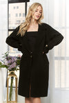 Chic black longline coat featuring a tailored fit, button details, and side pockets, ideal for stylish looks from a Long Island boutique fashion.