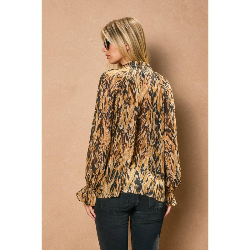 Long-sleeve button-down blouse in a bold animal print with a relaxed fit, perfect for chic Long Island boutique fashion.