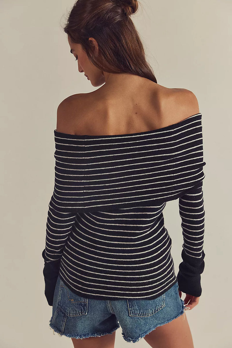 Off-the-shoulder black and white striped sweater with a fitted silhouette, perfect for Long Island boutique fashion styling.