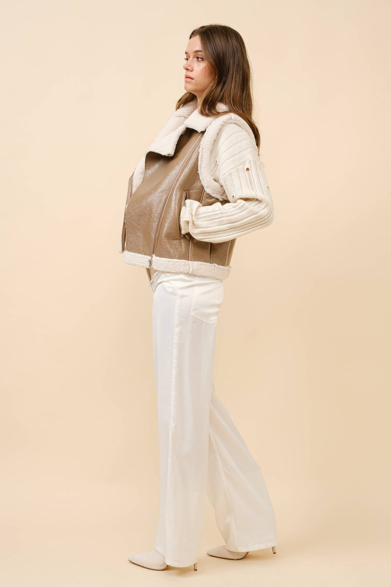 Faux leather vest with shearling trim and a cropped fit, perfect for stylish layering in Long Island boutique fashion.