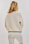 Oversized cream sweater featuring festive "Christmas Tree" stitching and a green trim, perfect for cozying up in Long Island boutique fashion.
