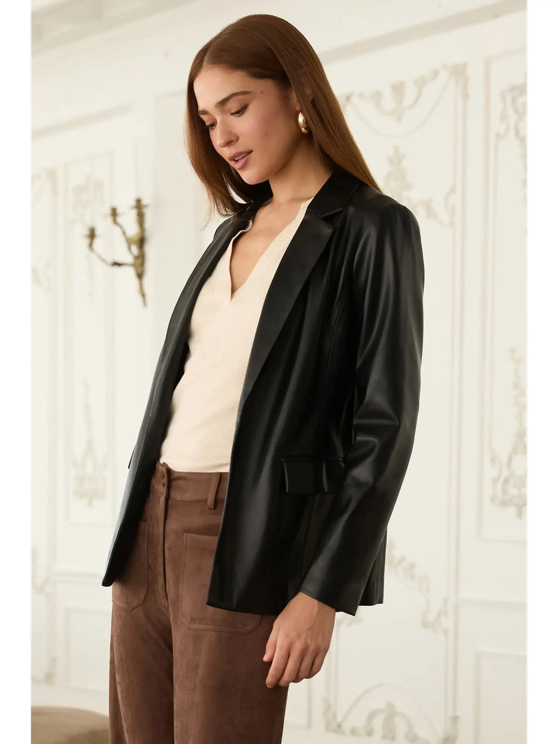 Sophisticated faux leather open blazer in sleek black, perfect for layering over soft neutrals, ideal for Long Island boutique fashion.