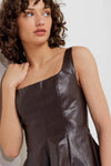 Stylish faux leather top in rich brown, featuring a square neckline and a fitted silhouette, perfect for Long Island boutique fashion.