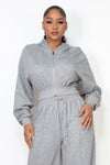 Cozy grey crop zip-up hoodie with a relaxed fit and hood, perfect for stylish layering in Long Island boutique fashion.