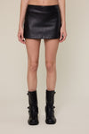 Sleek black faux leather mini skort with a fitted silhouette, perfect for a chic Long Island boutique fashion ensemble.