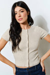 Beige ribbed button-up tee with a fitted silhouette and short sleeves, perfect for casual wear in Long Island boutique fashion.