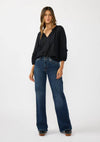 Flowy black blouse with frilled sleeves and a split neck, perfectly styled with high-waisted flared jeans in this Long Island boutique fashion look.