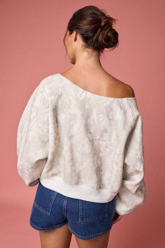 Off-shoulder camo print top in muted beige with balloon sleeves, perfect for casual chic looks at this Long Island boutique fashion.