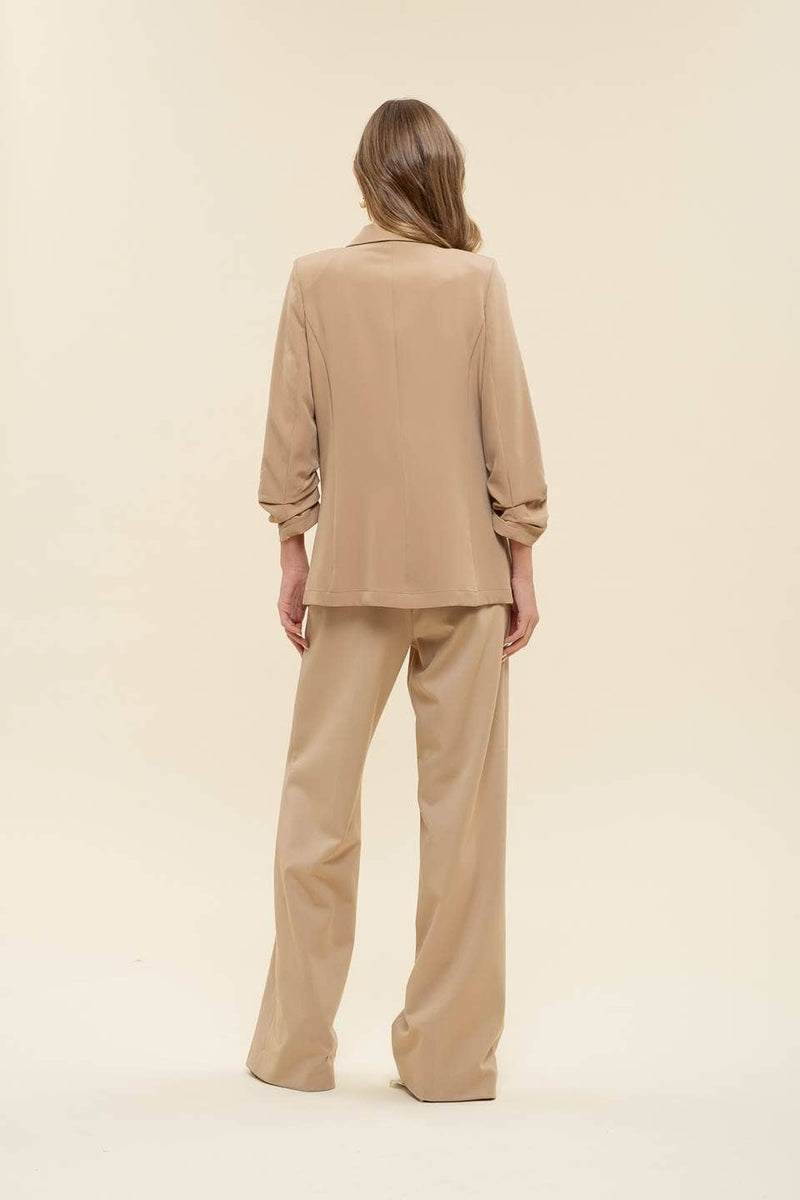 Chic 3/4 ruched sleeve blazer in a neutral beige, offering a relaxed fit perfect for layering in Long Island boutique fashion.