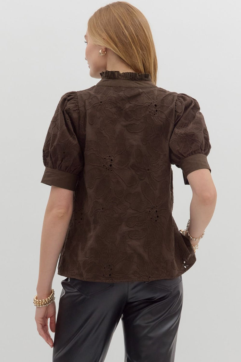 Brown floral embroidered puff sleeve top featuring a ruffled neckline and fitted silhouette, ideal for Long Island boutique fashion.