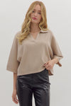 Beige 3/4 sleeve knit top with a V-neck and relaxed fit, perfect for layering in Long Island boutique fashion.