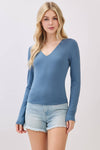 Fitted double layer V-neck long sleeve top in a soft blue hue, perfect for layering in Long Island boutique fashion.