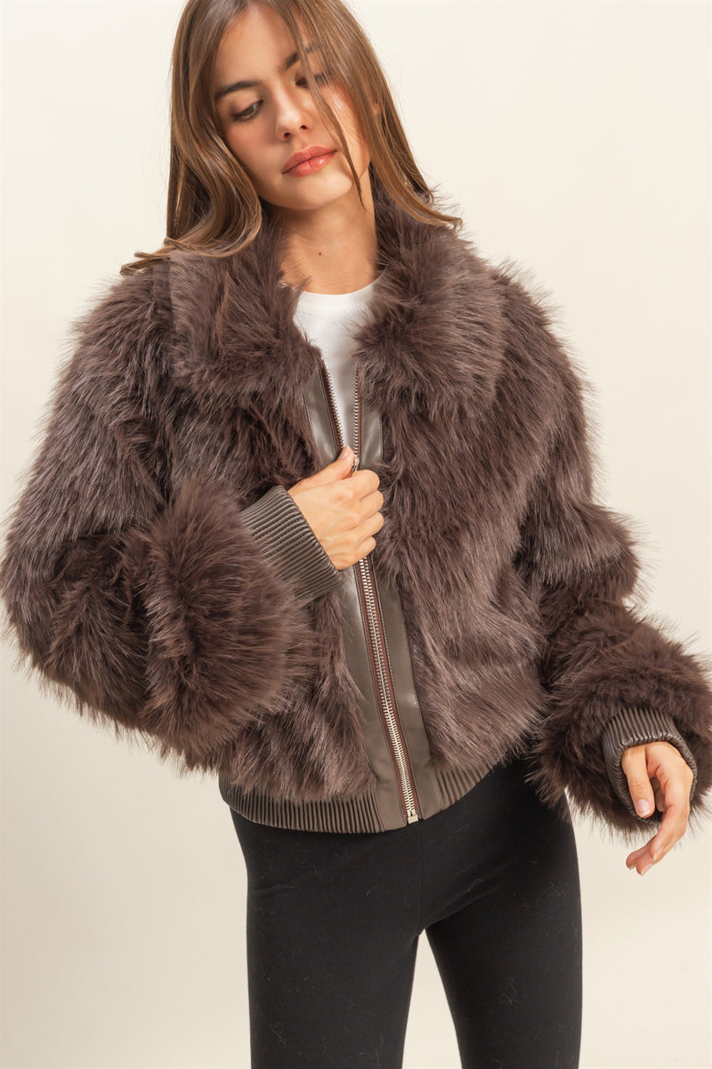 Luxuriously soft faux fur zippered jacket in rich brown with ribbed cuffs, perfect for chic comfort in Long Island boutique fashion.