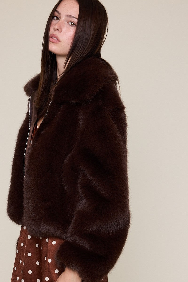 Luxurious brown faux fur jacket with a soft collar and a cozy fit, perfect for stylish layers in Long Island boutique fashion.