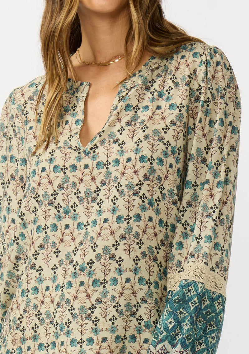 Split Ruffle Neck Border Print Blouse