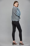 Cozy gray cable knit combined with denim, this chic sweater offers a relaxed fit perfect for Long Island boutique fashion.