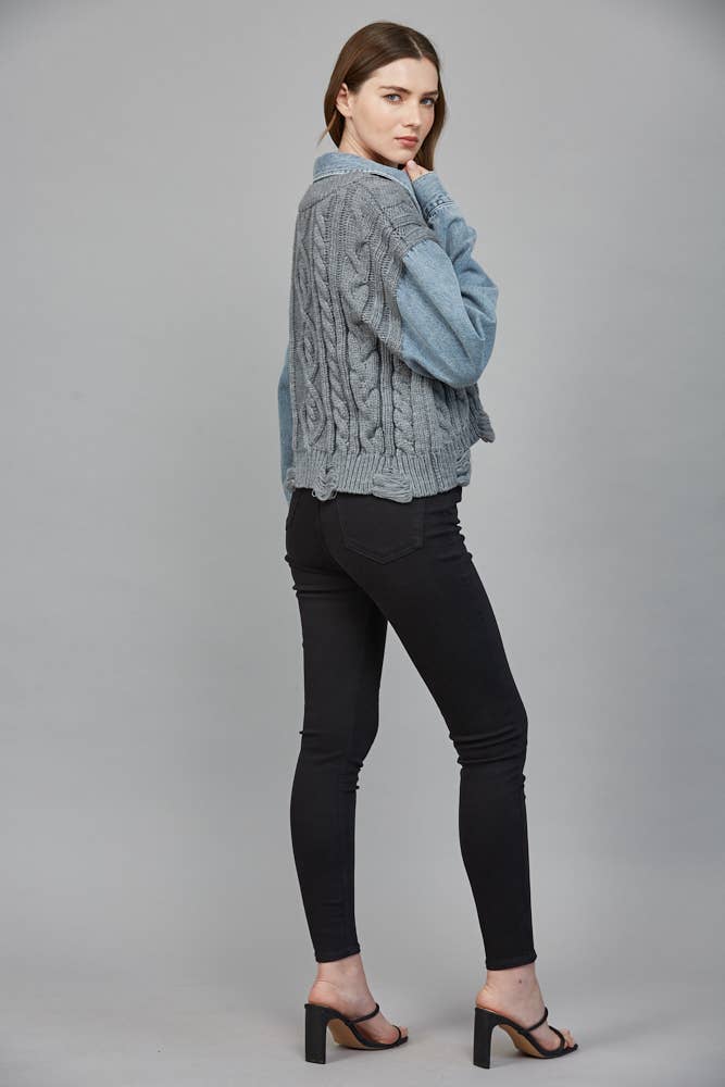 Cozy gray cable knit combined with denim, this chic sweater offers a relaxed fit perfect for Long Island boutique fashion.