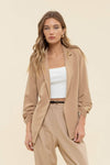Chic 3/4 ruched sleeve blazer in soft beige, tailored fit perfect for elevating any outfit, ideal for Long Island boutique fashion.