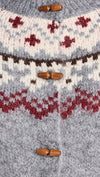 Soft gray toggle cardigan featuring a Faire Isle pattern with red and cream accents, ideal for cozy Long Island boutique fashion.